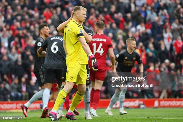 Martin Odegaard celebrates with Aaron Ramsdale of Arsenal after Mohamed Salah of Liverpool misses their penalty kick during the Premier League match...