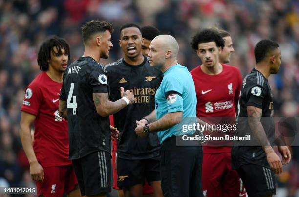 Ben White of Arsenal speaks with Referee Paul Tierney during the Premier League match between Liverpool FC and Arsenal FC at Anfield on April 09,...