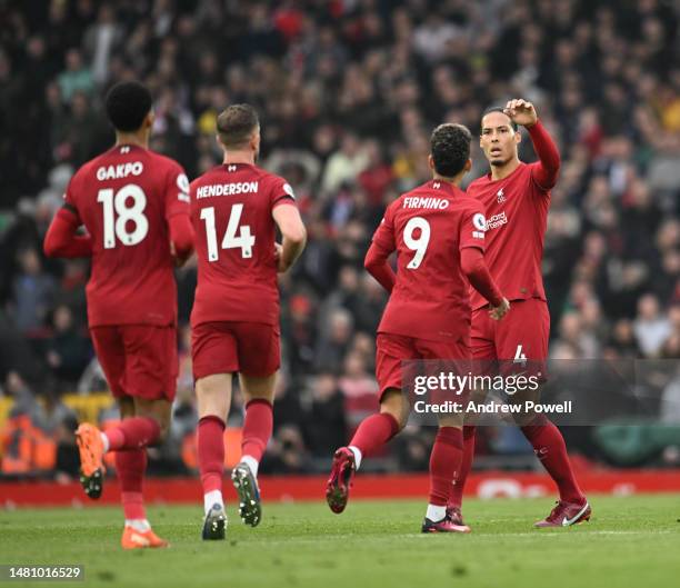 Roberto Firmino of Liverpool celebrates after scoring the second goal during the Premier League match between Liverpool FC and Arsenal FC at Anfield...