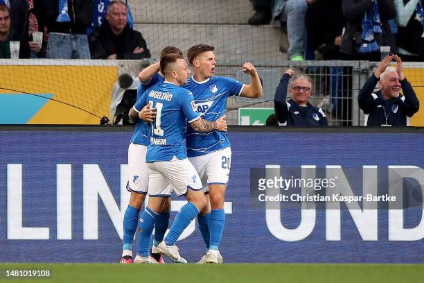 Angelino of TSG Hoffenheim celebrates with teammates after scoring the team's first goal during the Bundesliga match between TSG Hoffenheim and FC...