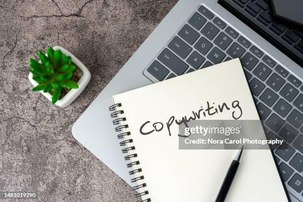 copy writing text on notepad with laptop - copy writing bildbanksfoton och bilder