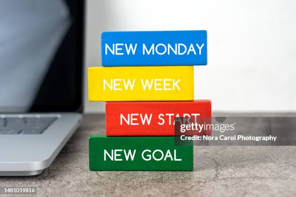 new monday, new week, new start, new goal text on wood block - monday fotografías e imágenes de stock