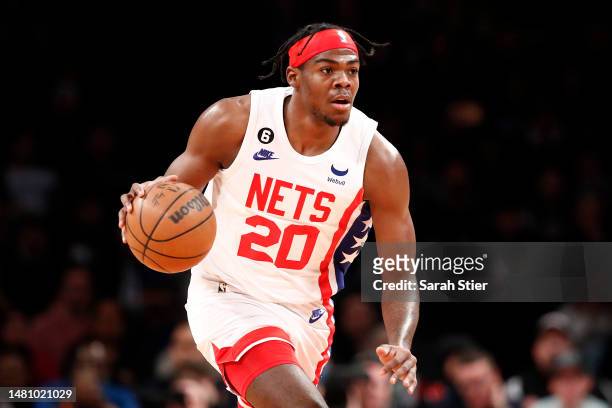 Day'Ron Sharpe of the Brooklyn Nets dribbles during the first half against the Philadelphia 76ers at Barclays Center on April 09, 2023 in the...