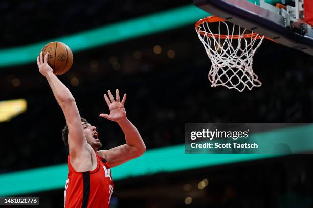 Alperen Sengun of the Houston Rockets goes to the basket against the Washington Wizards during the first half at Capital One Arena on April 9, 2023...