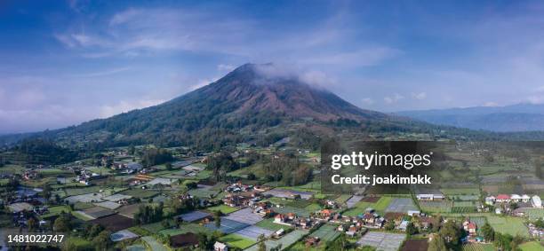 panoramic landscape of batur volcanic caldeira in bali indonesia - bali volcano stock pictures, royalty-free photos & images