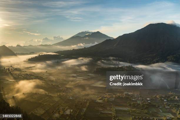 majestuous sunrise in batur area in bali indonesia - kintamani stock pictures, royalty-free photos & images