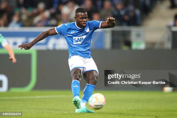 Ihlas Bebou of TSG Hoffenheim scores the team's second goal from a penalty kick during the Bundesliga match between TSG Hoffenheim and FC Schalke 04...