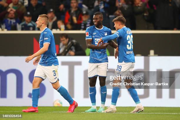 Ihlas Bebou of TSG Hoffenheim celebrates after scoring the team's second goal from a penalty kick with teammates during the Bundesliga match between...