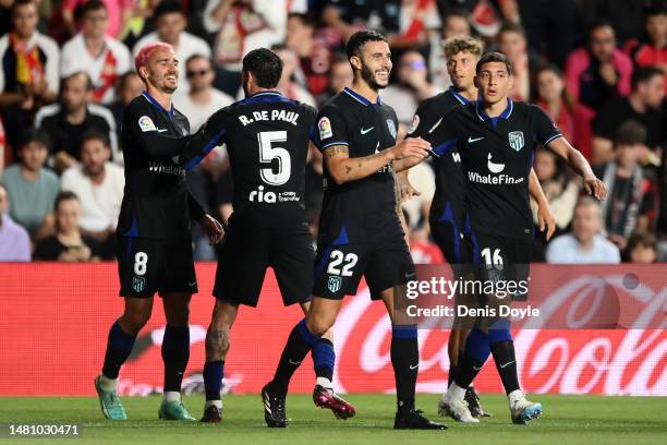 Mario Hermoso of Atletico Madrid celebrates after scoring the team's second goal with teammates during the LaLiga Santander match between Rayo...