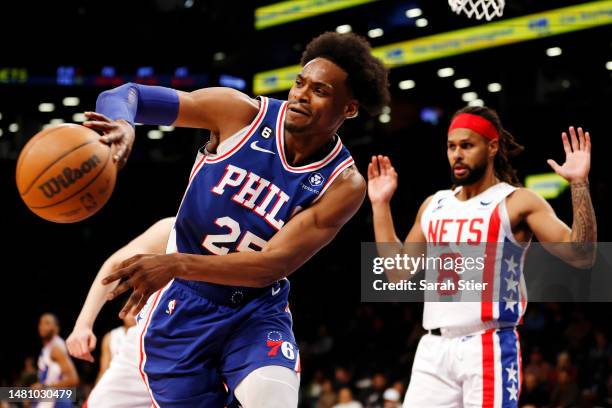 Danuel House Jr. #25 of the Philadelphia 76ers passes the ball as Patty Mills of the Brooklyn Nets defends during the second half at Barclays Center...