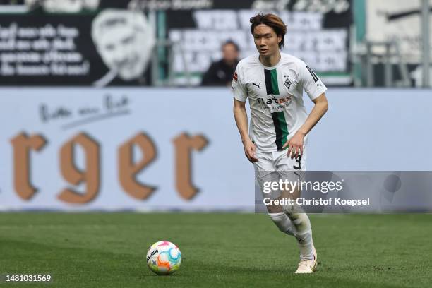 Ko Itakura of Moenchengladbach runs with the ball during the Bundesliga match between Borussia Mönchengladbach and VfL Wolfsburg at Borussia-Park on...