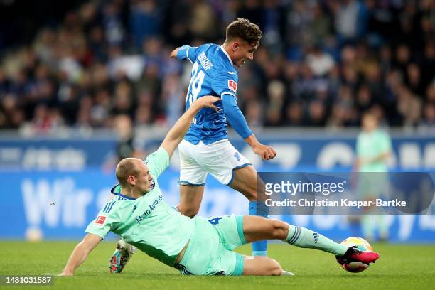 Tom Bischof of TSG Hoffenheim is challenged by Henning Matriciani of FC Schalke 04 during the Bundesliga match between TSG Hoffenheim and FC Schalke...