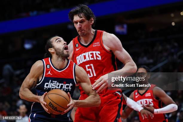 Xavier Cooks of the Washington Wizards handles the ball as Boban Marjanovic of the Houston Rockets defends during the second half at Capital One...