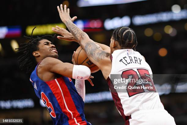 Jaden Ivey of the Detroit Pistons is defended by Dalen Terry of the Chicago Bulls in the second half at United Center on April 09, 2023 in Chicago,...