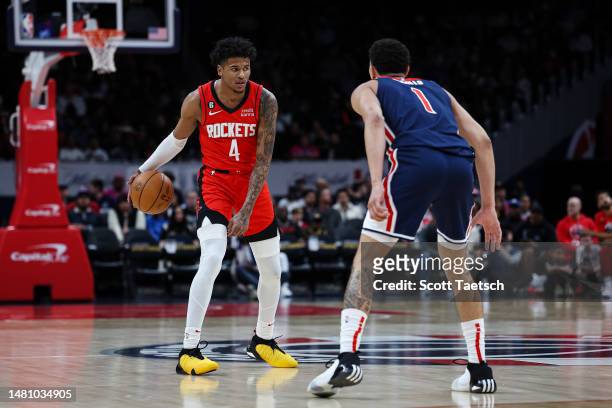 Jalen Green of the Houston Rockets handles the ball as Johnny Davis of the Washington Wizards defends during the first half at Capital One Arena on...