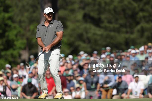 Brooks Koepka of the United States reacts to his putt on the seventh green during the final round of the 2023 Masters Tournament at Augusta National...