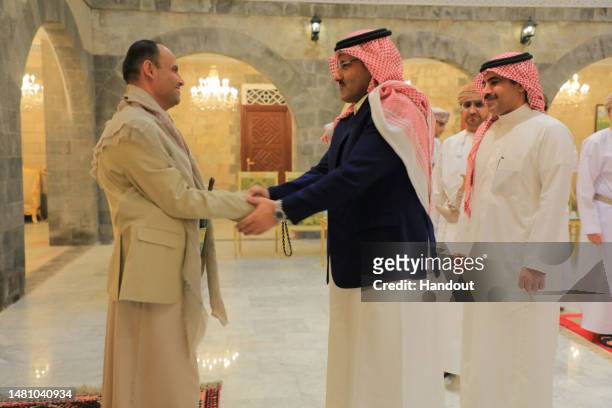 Handout photo released by Yemen's Houthis-run Saba News Agency shows the Omani and Saudi delegations in meeting Houthi officials, on April 09, 2023...
