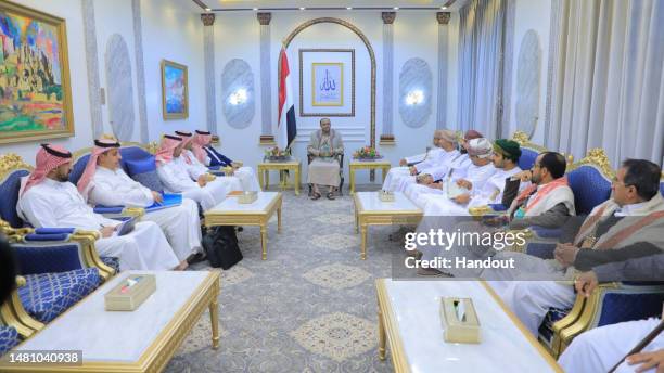 Handout photo released by Yemen's Houthis-run Saba News Agency shows the Omani and Saudi delegations in meeting Houthi officials, on April 09, 2023...