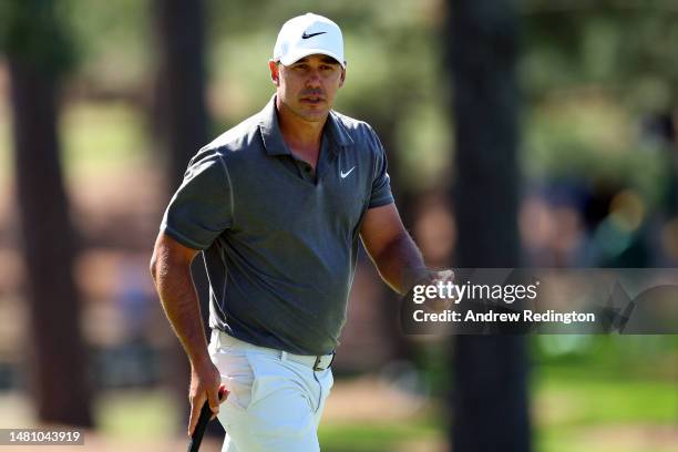 Brooks Koepka of the United States reacts to his putt on the seventh green during the final round of the 2023 Masters Tournament at Augusta National...