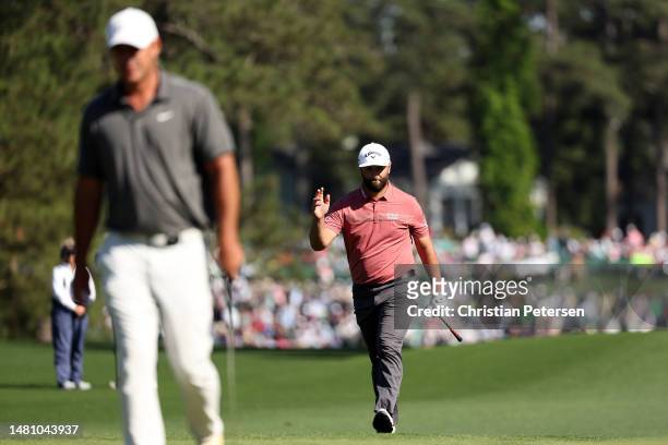 Jon Rahm of Spain reacts on the eighth green as Brooks Koepka of the United States looks on during the final round of the 2023 Masters Tournament at...