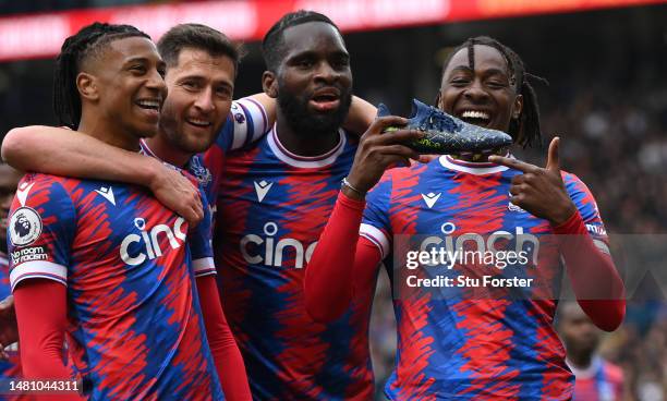 Crystal Palace player Eberechi Eze shows off his new balance boot as he celebrates with team mates after scoring the third Palace goal during the...