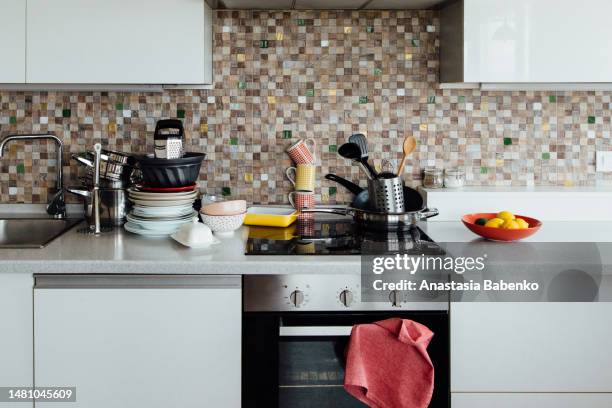 view of kitchen counter full of dishes and utensils - torchon photos et images de collection