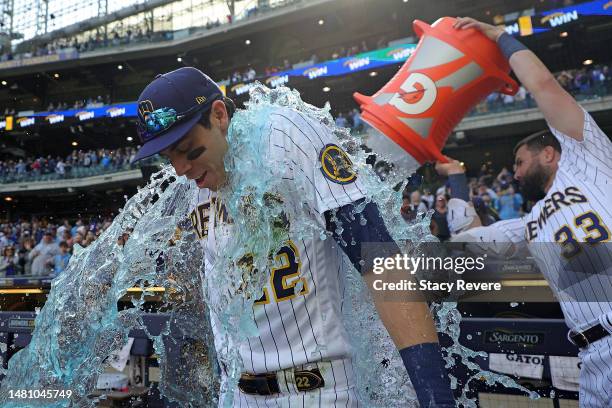 Christian Yelich of the Milwaukee Brewers is dunked following a game against the St. Louis Cardinals at American Family Field on April 09, 2023 in...