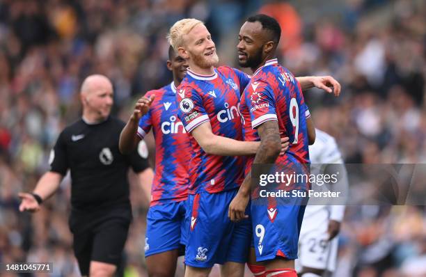 Jordan Ayew of Crystal Palace is congratulated by Will Hughes after scoring the fifth goal during the Premier League match between Leeds United and...