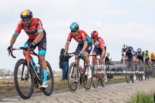 Andrea Pascualon of Italy and Team Bahrain-Victorious and Cedric Beullens of Belgium and Team Lotto-Dstny compete during the 120th Paris-Roubaix 2023...