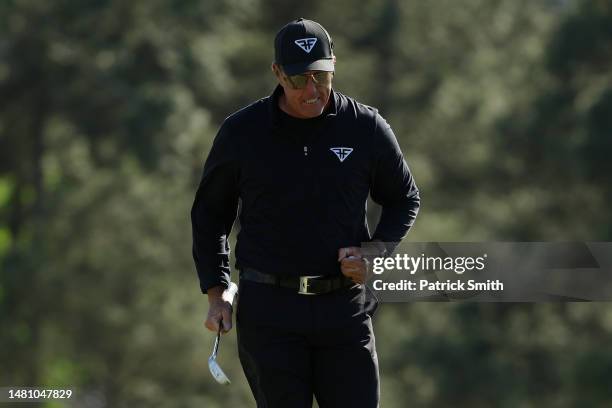 Phil Mickelson of the United States reacts to his birdie putt on the 18th green during the final round of the 2023 Masters Tournament at Augusta...