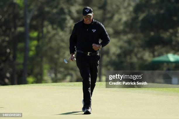 Phil Mickelson of the United States reacts to his birdie putt on the 18th green during the final round of the 2023 Masters Tournament at Augusta...