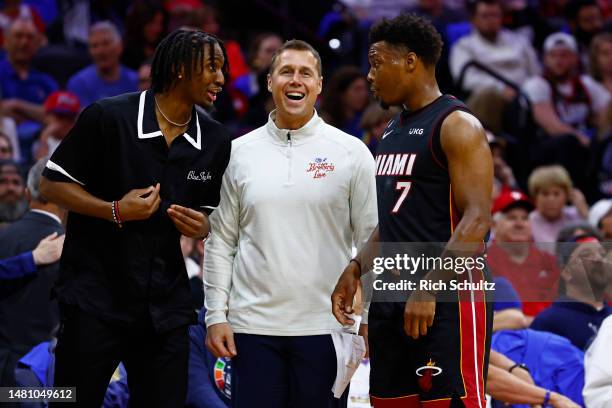 Kyle Lowry of the Miami Heat talks with assistant coach David Joerger and Tyrese Maxey, left, of the Philadelphia 76ers during a game at Wells Fargo...