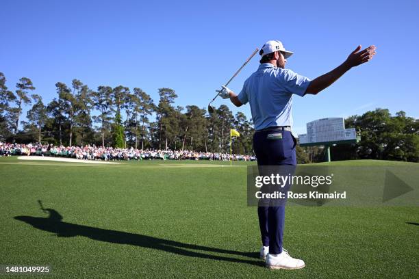 Cameron Young of the United States reacts to his chip on the 18th hole during the final round of the 2023 Masters Tournament at Augusta National Golf...