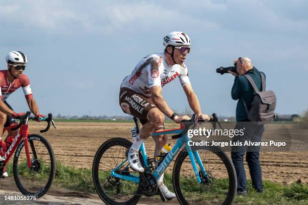 Stan Dewulf of Belgium and Team AG2R Citroën and Emils Liepins of Latvia and Team TREK-Segafredo compete during the 120th Paris-Roubaix 2023 a 257 km...