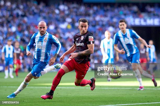 Alejandro Berenguer of Athletic Club runs after the ball followed by Aleix Vidal of RCD Espanyol during the LaLiga Santander match between RCD...