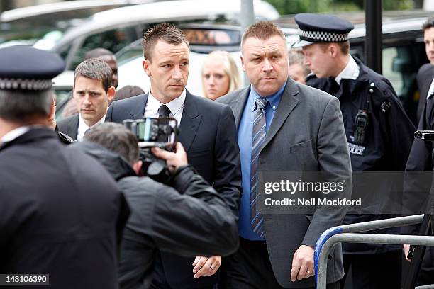 John Terry seen arrives at Westminster Magistrates Court as he continues his trial for allegedly racially abusing Anton Ferdinand on July 10, 2012 in...