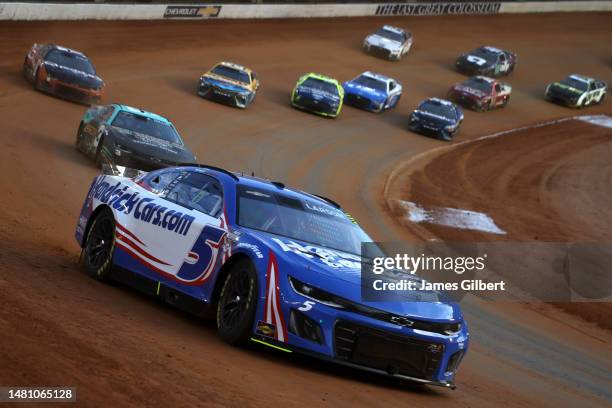 Kyle Larson, driver of the HendrickCars.com Chevrolet, leads the field during the NASCAR Cup Series Food City Dirt Race at Bristol Motor Speedway on...