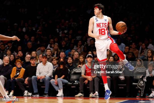 Yuta Watanabe of the Brooklyn Nets keeps the ball inbounds during the first half against the Philadelphia 76ers at Barclays Center on April 09, 2023...