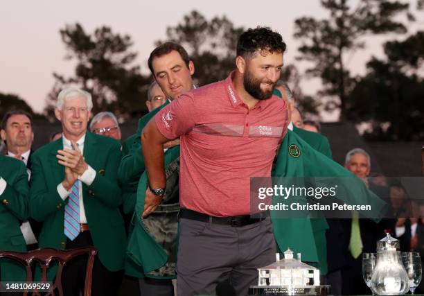 Jon Rahm of Spain is awarded the Green Jacket by 2022 Masters champion Scottie Scheffler of the United States during the Green Jacket Ceremony after...