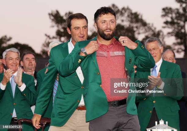 Jon Rahm of Spain is awarded the Green Jacket by 2022 Masters champion Scottie Scheffler of the United States during the Green Jacket Ceremony after...