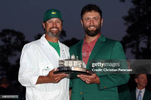 Jon Rahm of Spain poses with the Masters trophy and his caddie Adam Hayes during the Green Jacket Ceremony after winning the 2023 Masters Tournament...