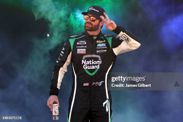 Corey LaJoie, driver of the NationsGuard Chevrolet, walks onstage during driver intros prior to the NASCAR Cup Series Food City Dirt Race at Bristol...