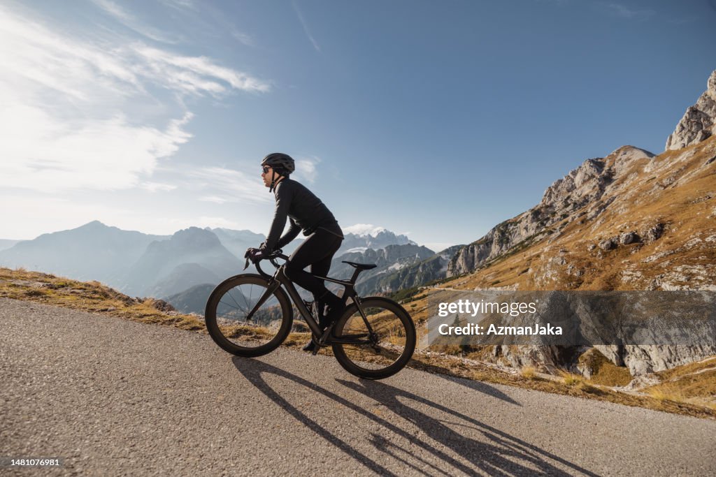 Recreational Cycling Adventure: Mountain Road with a Fit Athlete