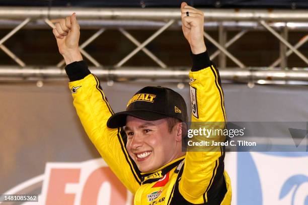 Christopher Bell, driver of the DeWalt Power Stack Toyota, celebrates in victory lane after winning the NASCAR Cup Series Food City Dirt Race at...