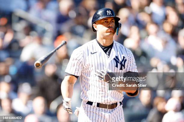 Giancarlo Stanton of the New York Yankees flips his bat after hitting a home run during the seventh inning against the San Francisco Giants at Yankee...