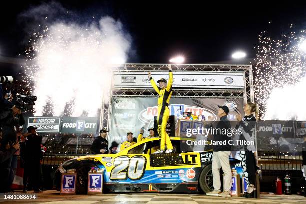 Christopher Bell, driver of the DeWalt Power Stack Toyota, celebrates in victory lane after winning the NASCAR Cup Series Food City Dirt Race at...