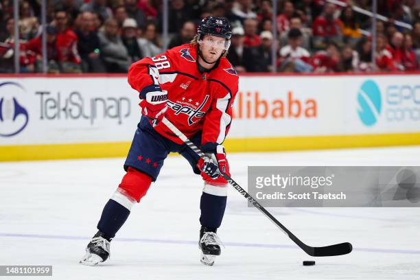 Rasmus Sandin of the Washington Capitals skates with the puck against the Florida Panthers during the second period of the game at Capital One Arena...
