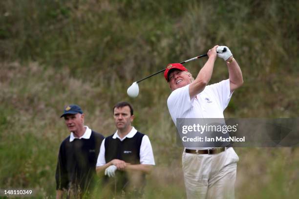 Donald Trump tees off from the third after the opening of The Trump International Golf Links Course on July 10, 2012 in Balmedie, Scotland. The...