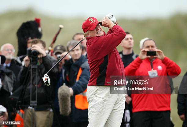 Donald Trump opens The Trump International Golf Links Course in Balmedie by hitting the first ball down the first fairway on July 10, 2012 in...