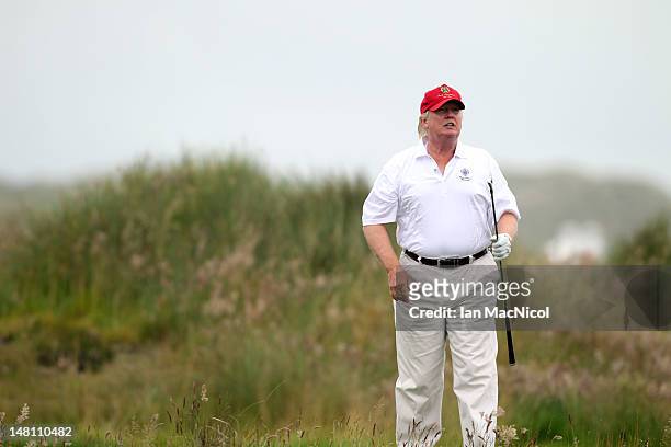 Donald Trump plays a round of golf after the opening of The Trump International Golf Links Course on July 10, 2012 in Balmedie, Scotland. The...